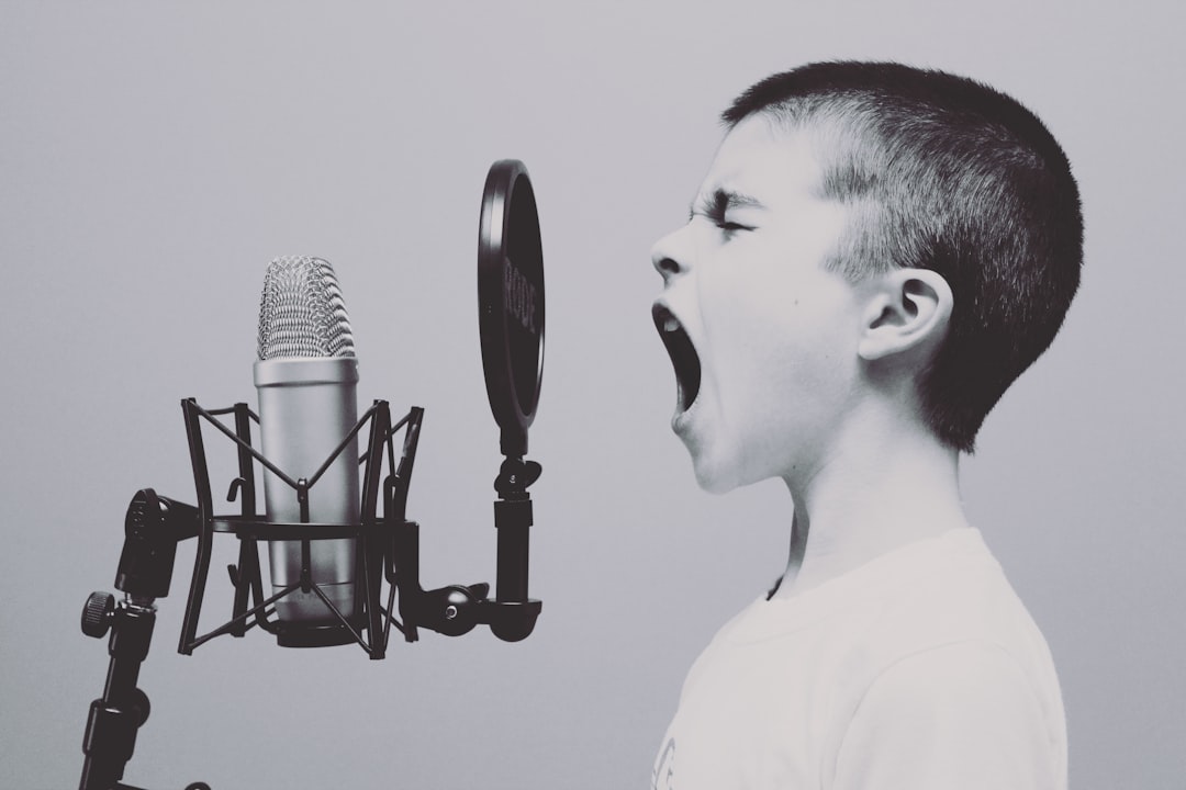 boy-singing-on-microphone-with-pop-filter-askeuozqhyu